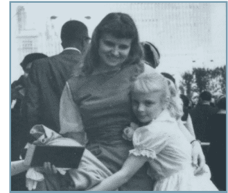 A woman and child are posing for the camera.